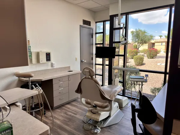 A quiet Gateway Family Dentistry treatment room looking out onto desert landscaping