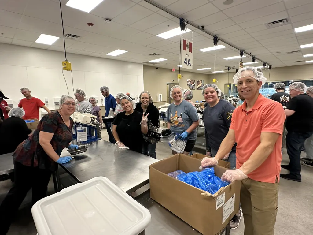 Dr. Gailey and the Gateway Family Dentistry team packing meals at Feed My Starving Children